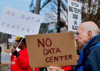 Growing Opposition to AI Data Centres Signals Trouble for Big Tech A surprising alliance is beginning to take shape across the United States, as groups with sharply different political views unite over a common concern. From conservative voters in traditionally Republican regions to progressive activists and educators in liberal states, resistance is mounting against the rapid expansion of artificial intelligence data centres. What once seemed like a purely technological or economic issue is now evolving into a broader public debate about corporate influence and community impact. This wave of opposition has caught policymakers off guard, particularly at the federal level where accelerating AI infrastructure has been treated as a national priority. Early policy decisions encouraged fast-tracked development with minimal regulatory hurdles, largely to maintain a competitive edge in the global AI race. Backed by major technology corporations investing hundreds of billions of dollars, the push for rapid construction has been intense. However, the speed and scale of these projects have raised concerns that long-term consequences are being overlooked. At the state level, governments that initially welcomed these investments are beginning to face backlash from residents. While data centres promise economic growth, they also bring significant strain on local resources. Increased electricity consumption can drive up utility costs, while heavy water usage and pressure on infrastructure create additional challenges for surrounding communities. As these impacts become more visible, frustration is growing among citizens who feel their needs are being sidelined in favor of corporate interests. Political leaders are now starting to reassess their positions. Some who once competed to attract tech investment are calling for stronger oversight and more balanced approaches. The issue is gaining traction across party lines, with debates focusing not only on economic benefits but also on environmental sustainability and social equity. As more projects face delays or cancellations due to local resistance, it is clear that unchecked expansion is no longer politically viable. Underlying this shift is a broader unease about the role of artificial intelligence in society. While experts remain optimistic about its long-term benefits, public opinion is far more cautious. Concerns about job displacement, environmental costs, and widening inequality are fueling skepticism. The growing resistance to data centre development reflects a deeper demand for accountability, signaling that communities are no longer willing to accept technological progress without meaningful safeguards.